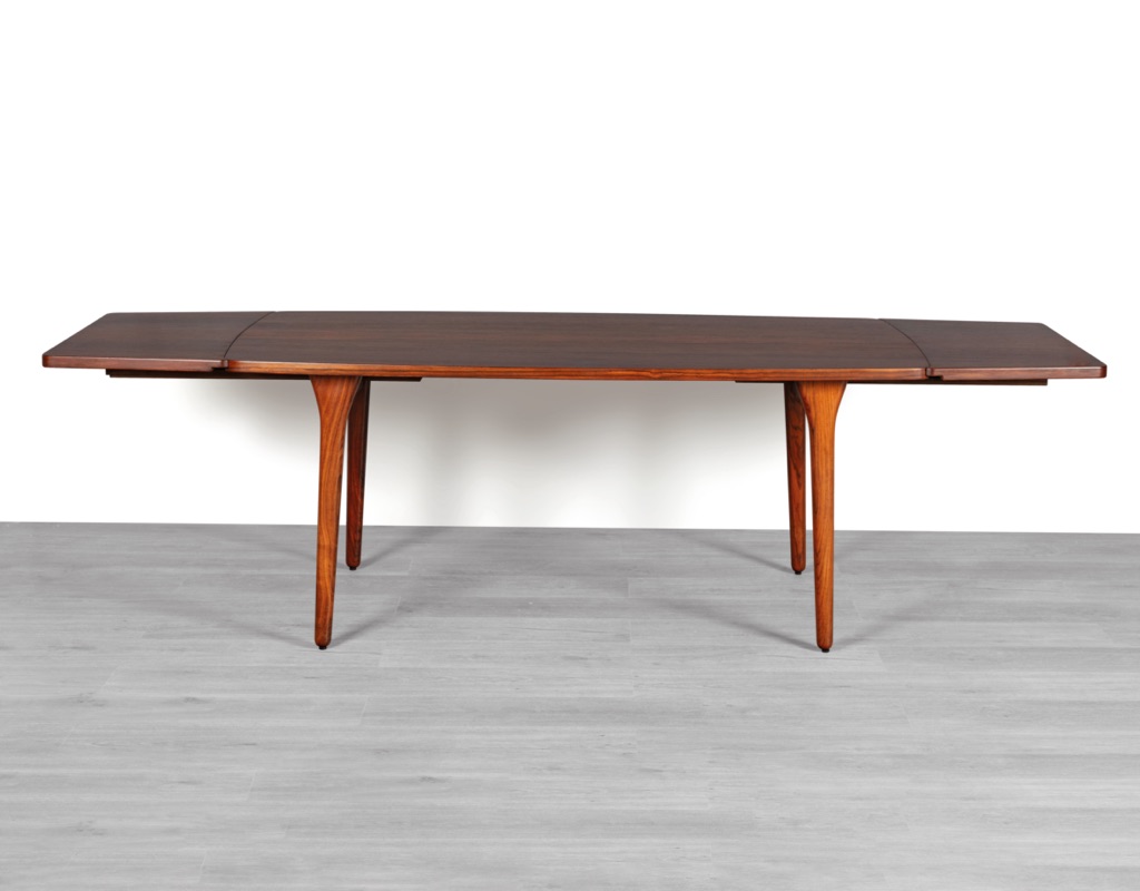 Mid century modern Henning Kjaernulf dining table Bruno Hansen Mobelfabrik Danish 1960s Brazilian Rosewood extension leaves boat shape curves