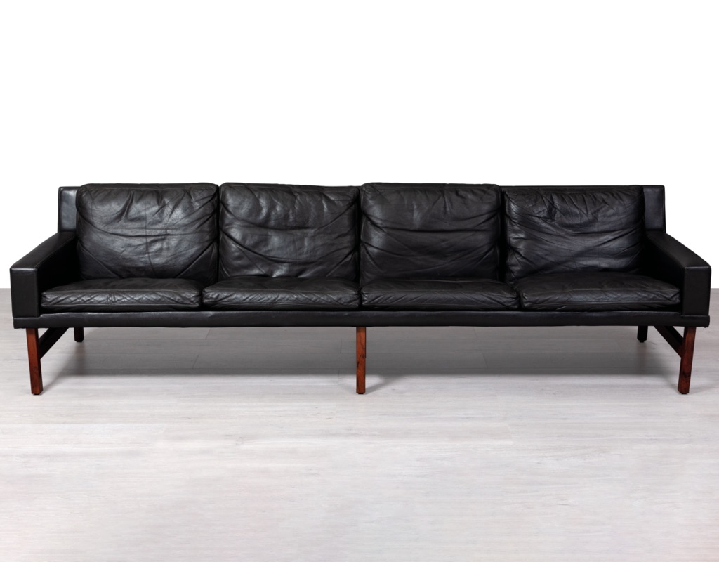 Mid century modern Danish vintage black leather four seater sofa couch by Sven Ellekaer for Henry Rolschau Mobler Brazilian rosewood legs patina large