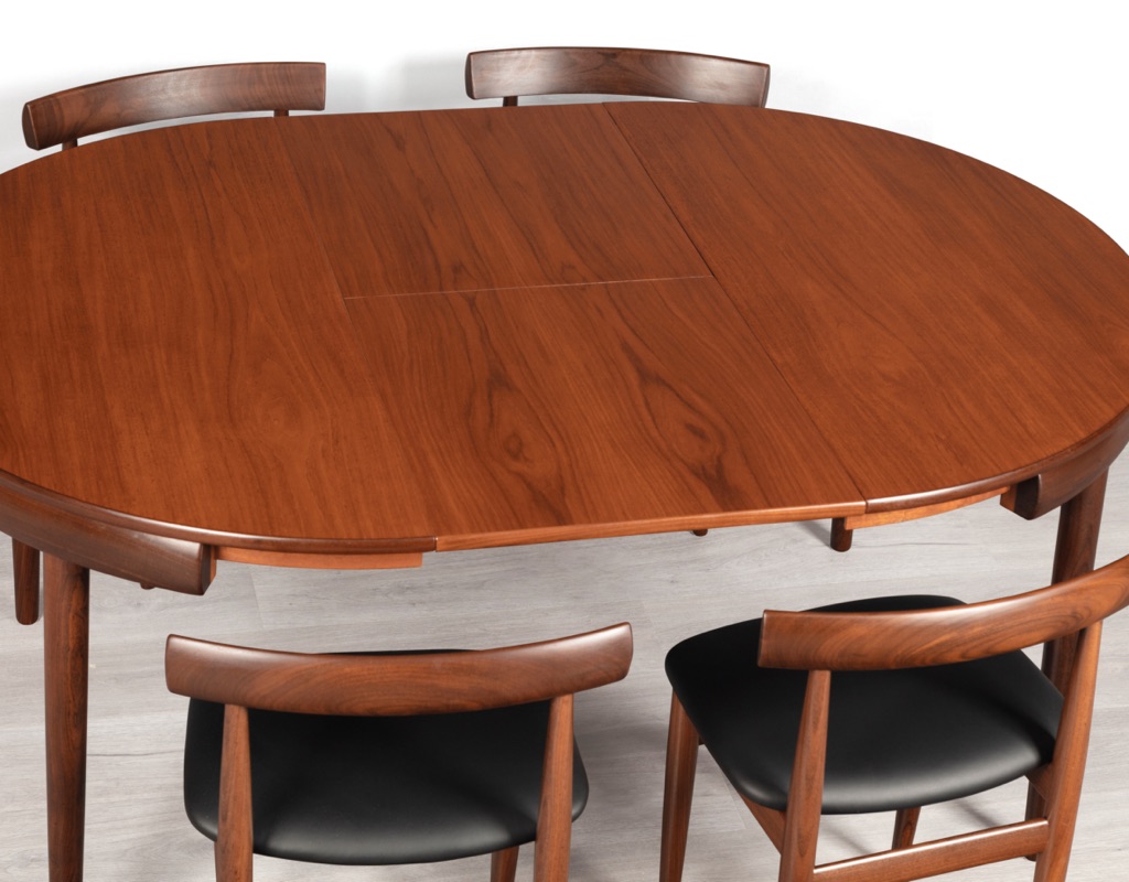 Mid century modern Hans Olsen Roundette Dining Setting Frem Rojle Denmark 1950 teak butterfly extension leaf original imported Scandinavian Danish design close up skirt table