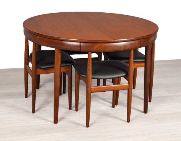 Mid century modern Hans Olsen Roundette Dining Setting Frem Rojle Denmark 1950 teak butterfly extension leaf original imported Scandinavian Danish design chairs pushed in under table top edge
