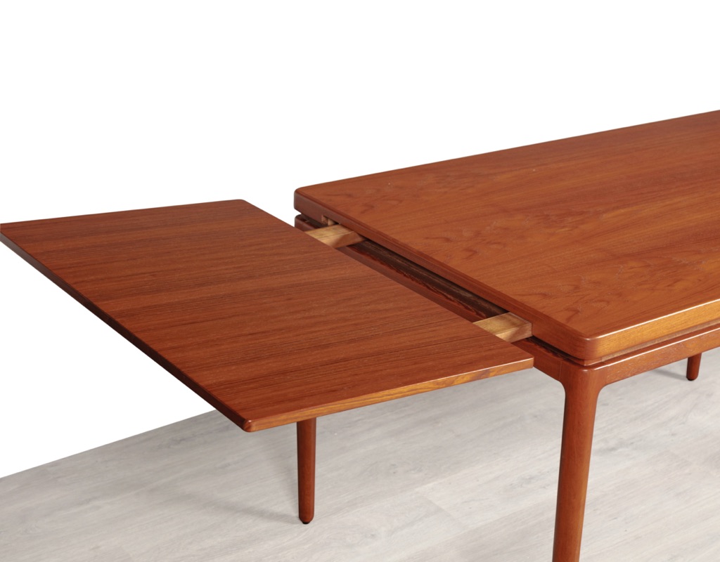 Mid century modern Johannes Andersen dining table by Christian Linnebergs Mobelfabrik Danish vintage 1960s extension teak table with concealed leaves Denmark Scandinavian clips in