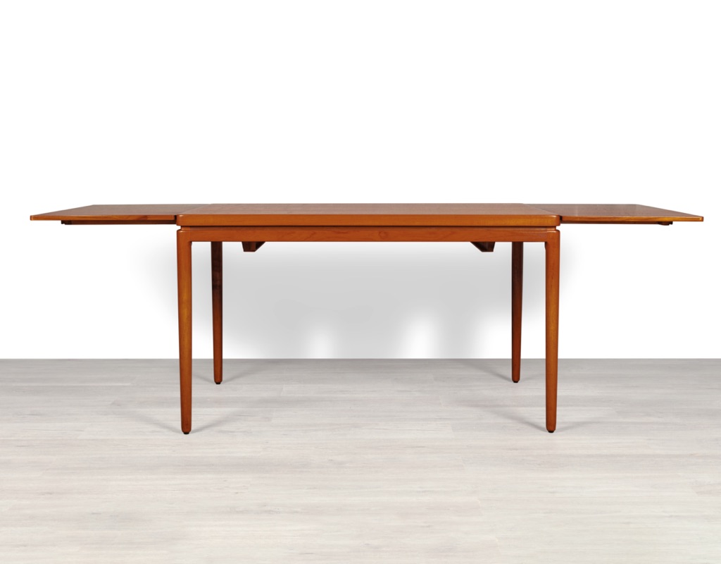 Mid century modern Johannes Andersen dining table by Christian Linnebergs Mobelfabrik Danish vintage 1960s extension teak table with concealed leaves Denmark Scandinavian extended