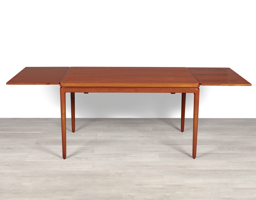 Mid century modern Johannes Andersen dining table by Christian Linnebergs Mobelfabrik Danish vintage 1960s extension teak table with concealed leaves Denmark Scandinavian detailed legs