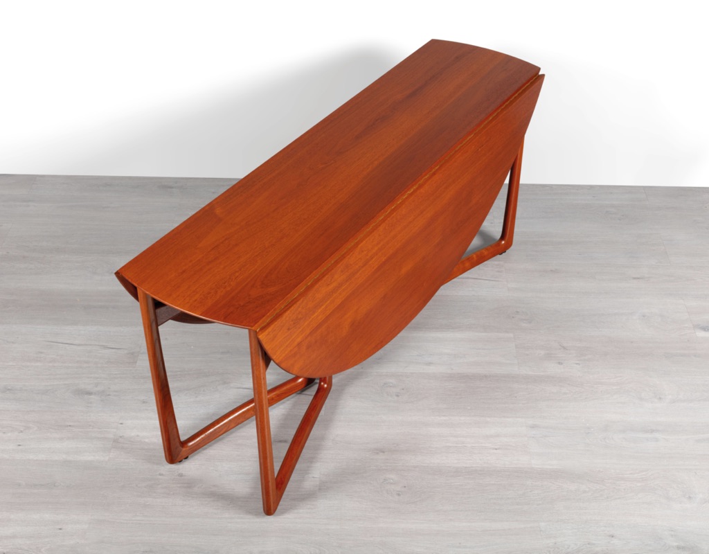 Mid century modern Danish drop leaf dining table by Peter Hvidt & Orla Molgaard Nielsen For France & Son Denmark 1950s solid teak top oval design gate leg sides fold down