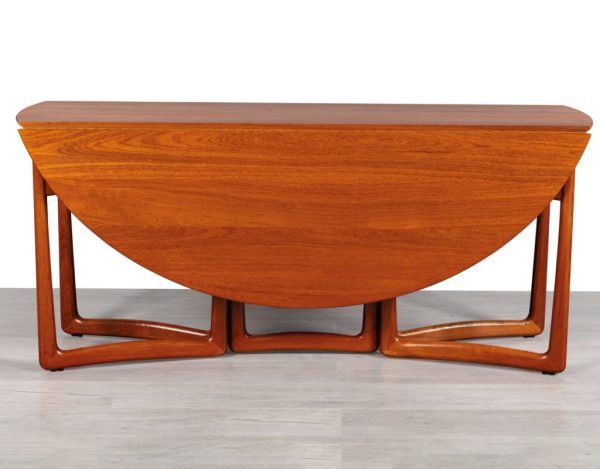 Mid century modern Danish drop leaf dining table by Peter Hvidt & Orla Molgaard Nielsen For France & Son Denmark 1950s solid teak top oval design gate leg organic shape brass detail