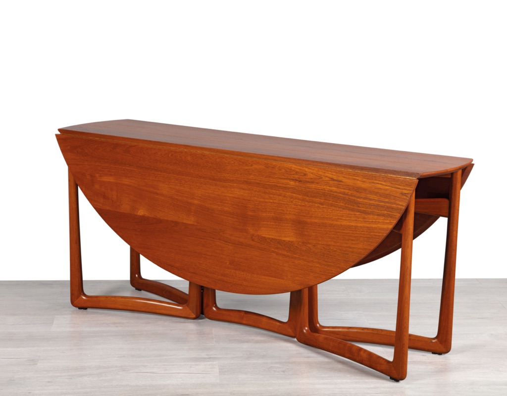 Mid century modern Danish drop leaf dining table by Peter Hvidt & Orla Molgaard Nielsen For France & Son Denmark 1950s solid teak top oval design gate leg side view