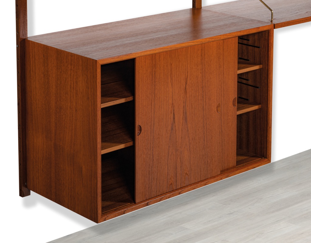 Mid century modern Poul Cadovius Model Royal Shelving System Danish vintage 1950s wall mounted shelving system bookshelf brass supporting arms Scandinavian design sliding door cabinet in teak