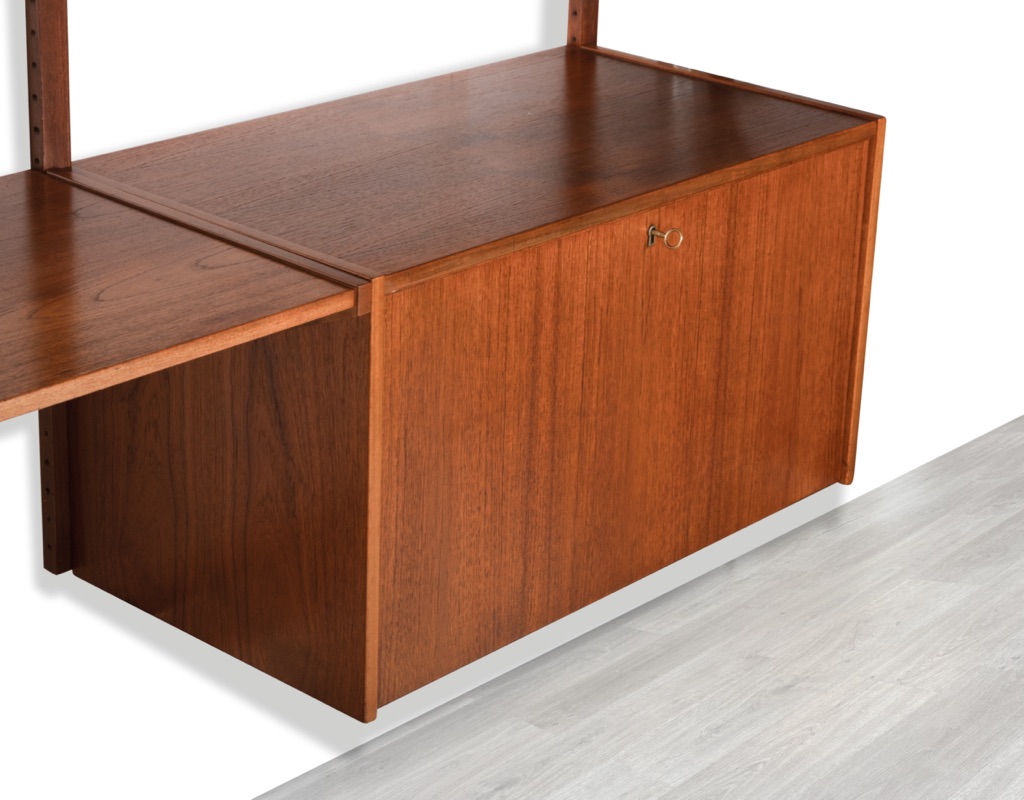 Mid century modern wall mounted shelving system Kurt Ostervig Poul Cadovius Peter Sorensen Kai Kristiansen Danish vintage bookshelf storage teak 1960 cabinet drop front