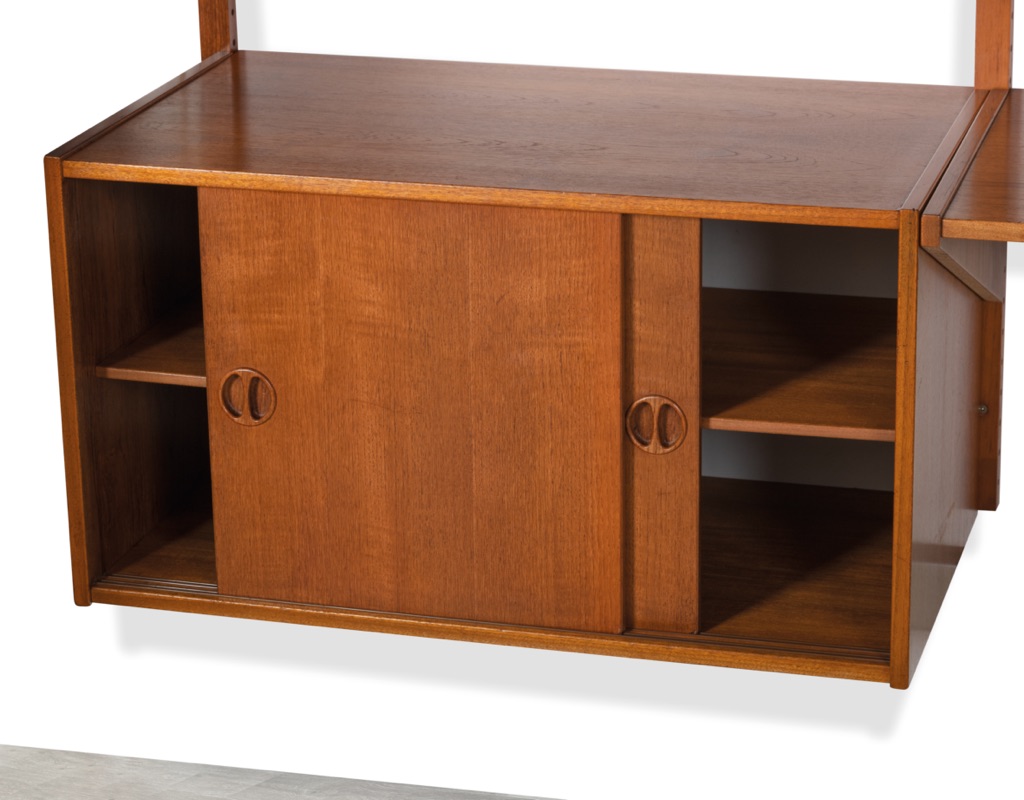 Mid century modern wall mounted shelving system Kurt Ostervig Poul Cadovius Peter Sorensen Kai Kristiansen Danish vintage bookshelf storage teak 1960 sliding door