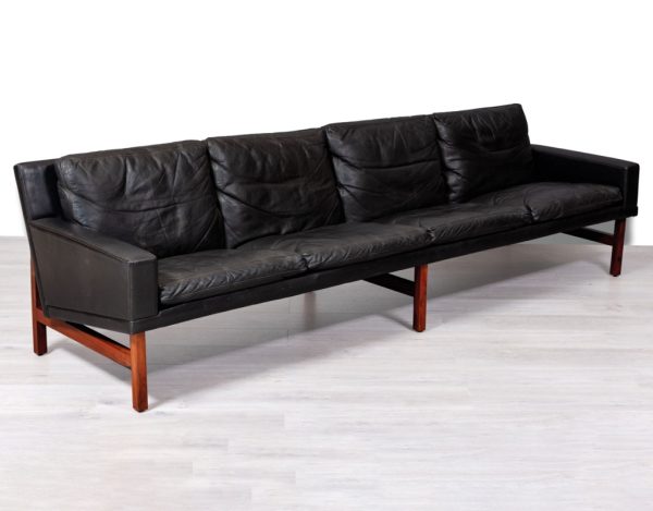 Mid century modern Danish vintage black leather four seater sofa couch by Sven Ellekaer for Henry Rolschau Mobler Brazilian rosewood legs patina